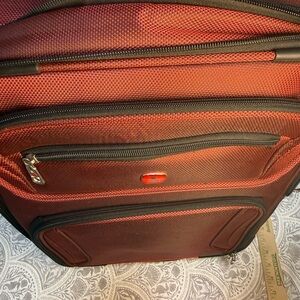 Stylish Red Swiss Gear Luggage with wheels